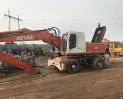 колесный экскаватор atlas 1704